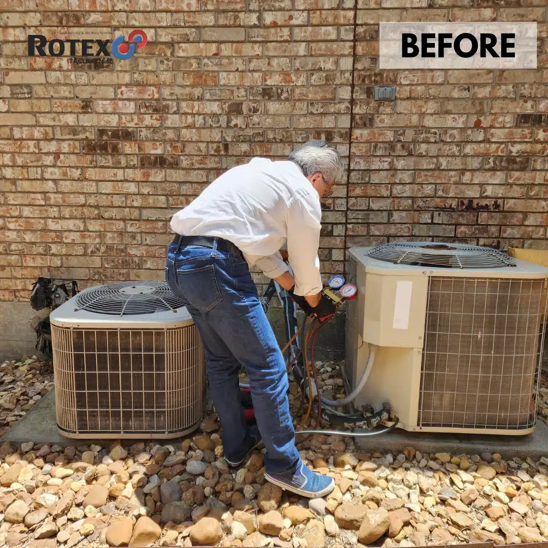 Technician servicing air conditioning units