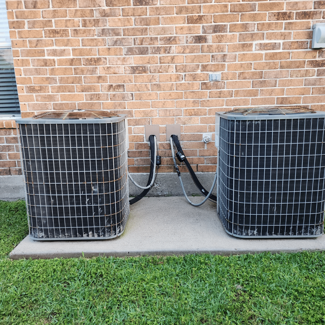 Two air conditioning units outside building