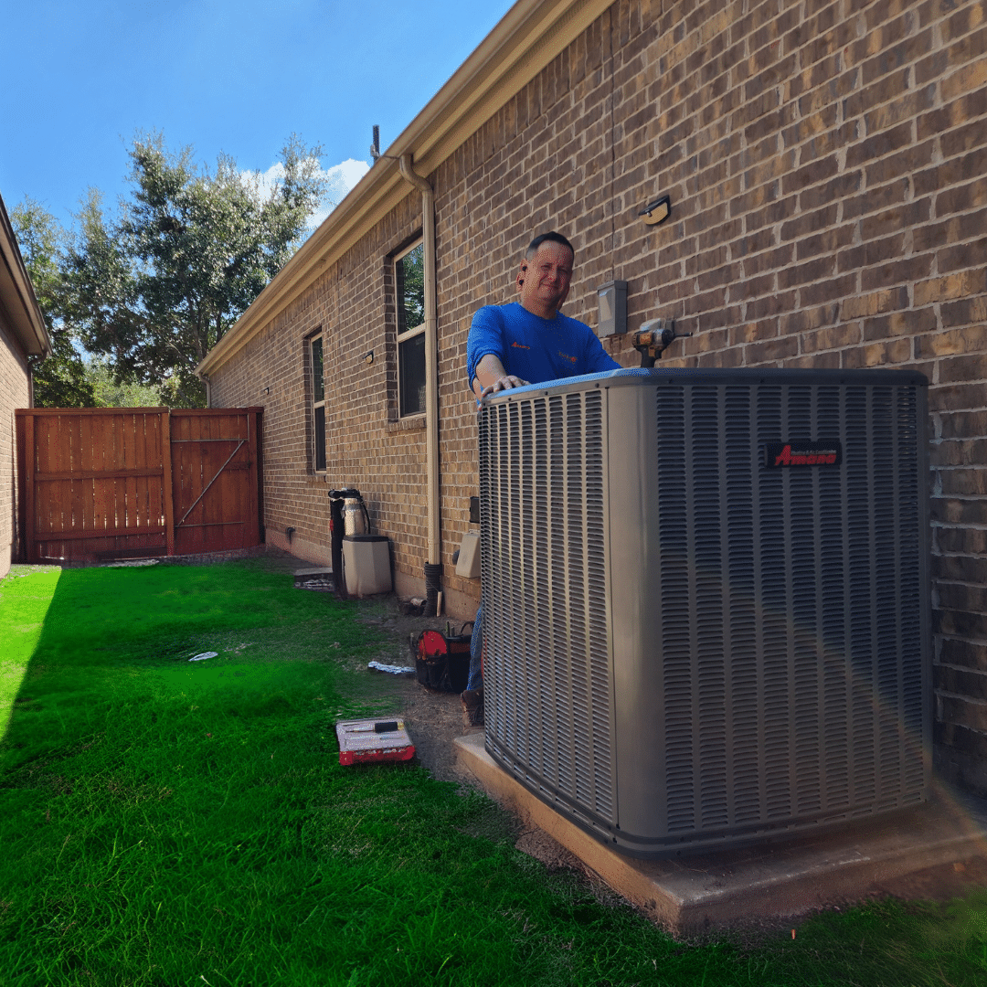 Man working on air conditioning unit_spring tx