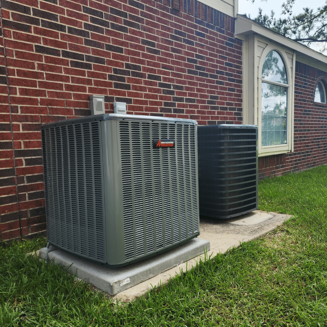 Two air conditioning units outside house