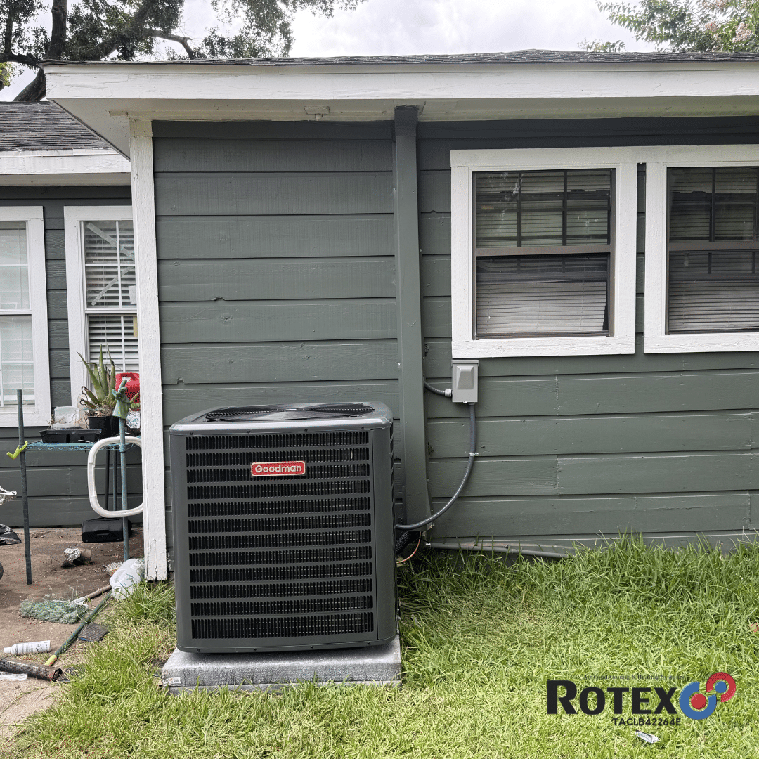 Air conditioning unit beside house